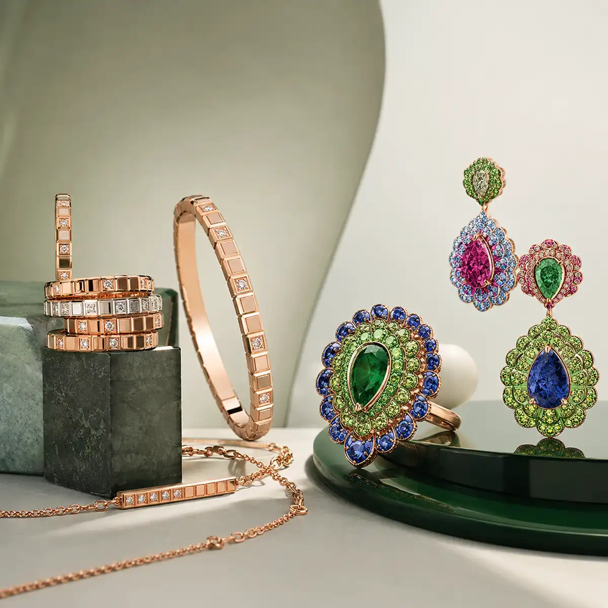 Coloured gemstones displayed in jewellery settings showing varied lighting effects
